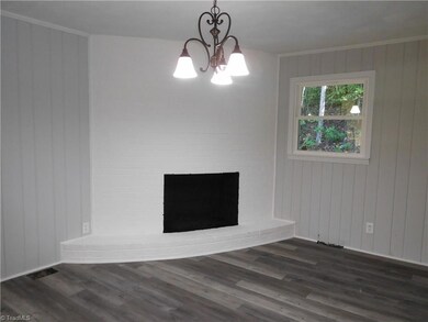 Dining Room.  Beautiful FP located in DR (FP is Sold As Is). Great Space. New Vinyl Flooring.