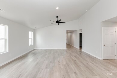 Unfurnished living room with lofted ceiling, light wood-style flooring, a ceiling fan, and recessed lighting