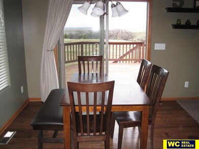 Dining area attached to open kitchen and living room.