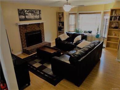 Living room w/ Bay window & Fireplace