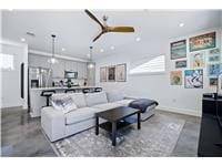 Living room with a ceiling fan and recessed light