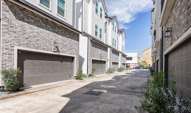 Nice two car garage with auto opener/shelving/stor