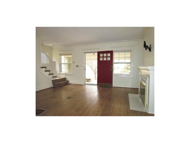 Large living room with wood floors.