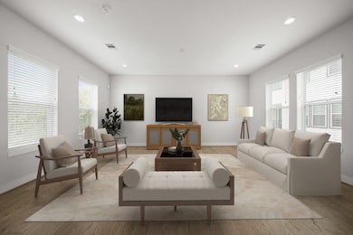 The spacious family room provides a flexible space that suits a variety of needs and with a multitude of windows accented by blinds and recessed lighting throughout. There is plenty of light flowing throughout the entire second floor. This room has been virtually staged.