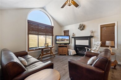 The large living room has cathedral ceilings and t