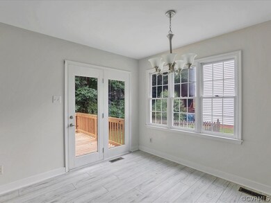 Dining area with French doors to the rear deck.