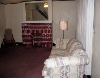 Living Room. Spacious with a brick Decorator Firep