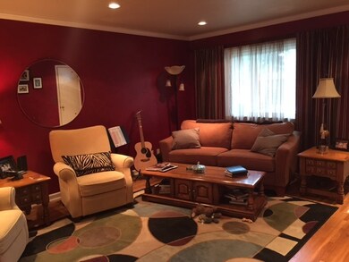 Living room opens to the dining room and has hardw