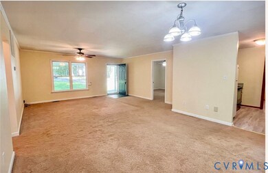 Spare room with light carpet, ceiling fan, a chandelier, and ornamental molding