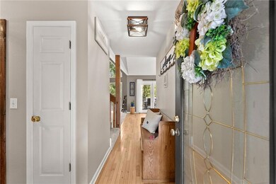 Hall featuring light wood-type flooring
