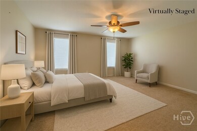 Virtually Staged Primary Bedroom on Main Floor
