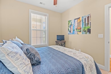 Bedroom featuring carpet and ceiling fan