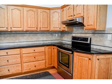 Kitchen has tile backsplash.