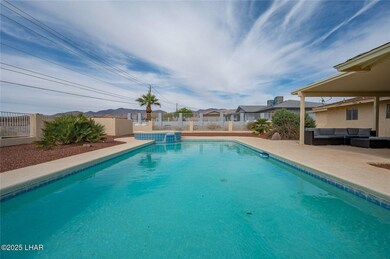 View of pool featuring a mountain view, outdoor lo