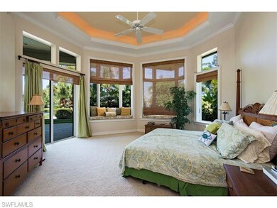 Large mater bedroom with access and bay window vie