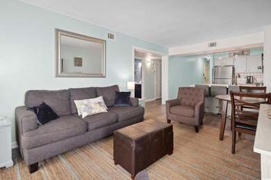 Living room featuring light wood-style floors