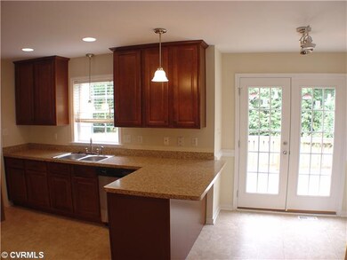 Kitchen - Bar overhang, new door leading to deck.