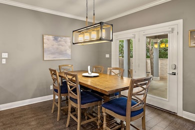 Dining room with ornamental molding, baseboards, 