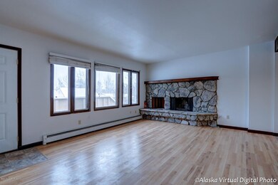 Living rm fireplace + front windows