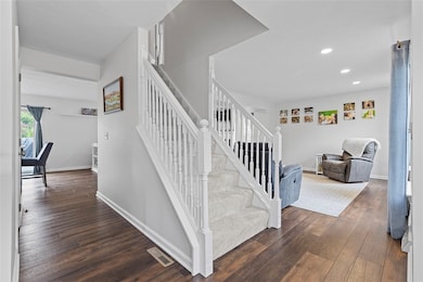 A coat closet and powder room complete the space w