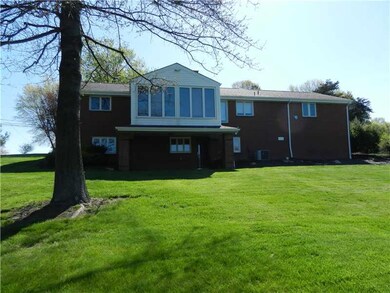 Exterior Back. Check out the sunroom overlooking t