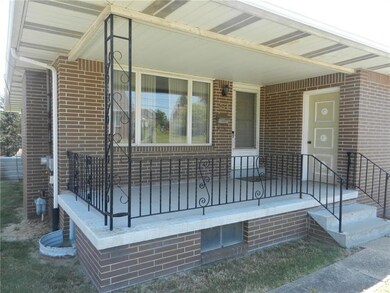 Front porch.  Door to the right goes in to the hea