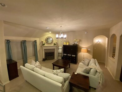 High ceilings and a corner fireplace adorn this inviting living room space. Curved entry ways and open floorplan is a signature Plantation home plus!