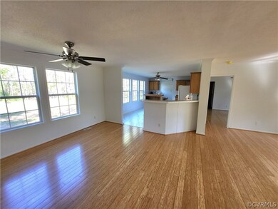 featuring bamboo flooring, ceiling fan