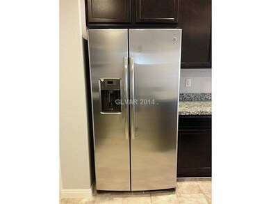 Property Photo. GE stainless steel fridge