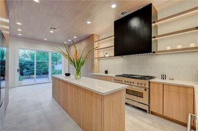 Kitchen with extractor fan, visible vents, high en