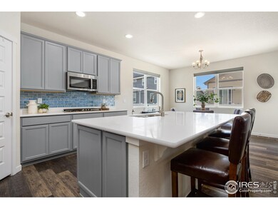 Gas cooktop, double oven, quartz counter tops and pantry