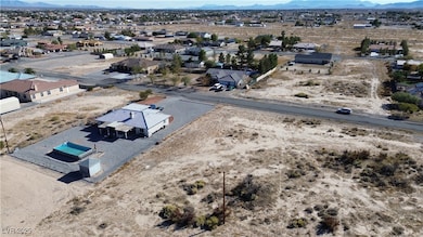 Aerial perspective of suburban area with a mountainous background