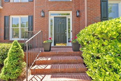 Entrance to property with brick siding