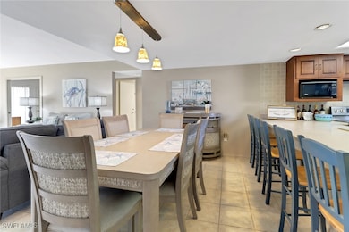 Dining room with light tile patterned floors