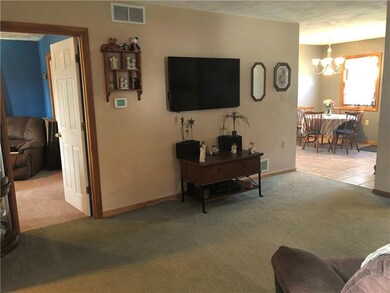 Family room with a view of the master and kitchen.