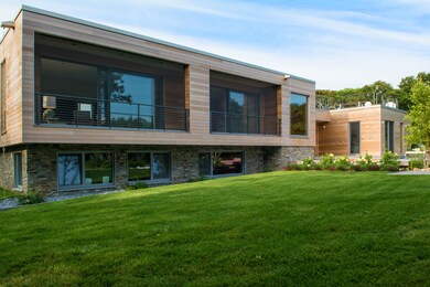Oversized windows facing the Ocean at rear of house