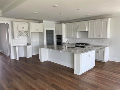 Kitchen with dark hardwood / wood-style flooring, 