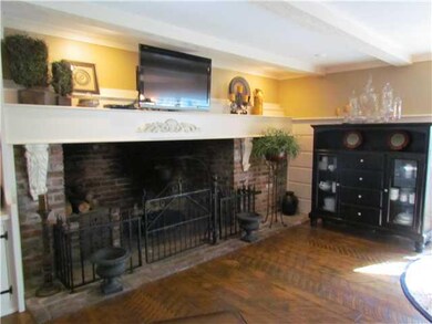 Hearth Room. Custom Mantle and Hardwood floors and Built ins