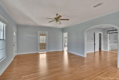 Gorgeous archway leading to dining area and kitche