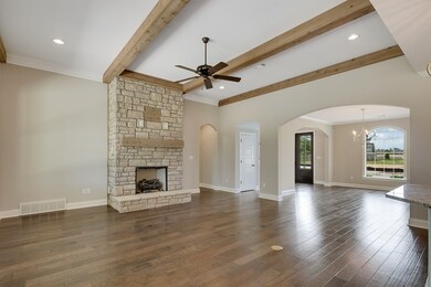 Stone fireplace and rustic beams give you the cozy