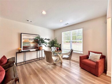 Dining space with light wood-style flooring, recessed lighting, and baseboards