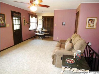 The open floor plan has a large family room with w