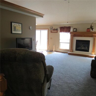 Great room with fireplace, ceiling fan, plant ledg
