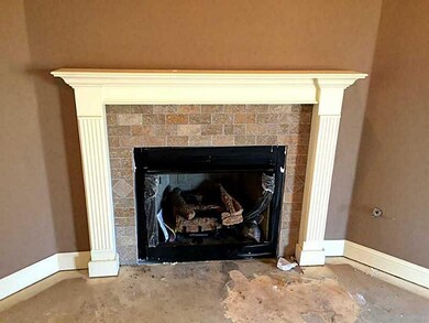 Living Room. Corner gas log fireplace with gorgeou