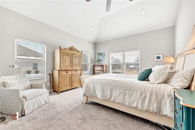 Large master bedroom with vaulted ceiling and two