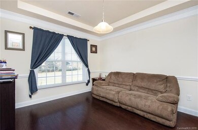 This is the room immediately to your left as you enter the home... it is a formal dining room. Sellers are currently using as flex space