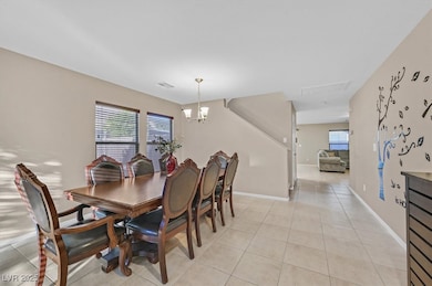 Dining space featuring a chandelier, a healthy amo