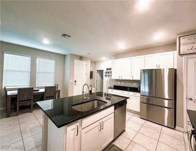 Kitchen featuring stainless steel appliances, ligh