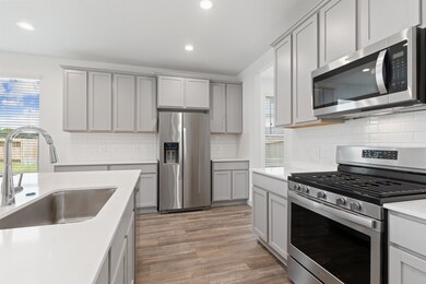 The Gourmet Kitchen comes with the Dupure Water Filtration System, Deep Stainless Steel Farmer Sink, Swan Pull Out Faucet and more!   Stunning Gourmet Kitchen for all those Cooks with Memories for Family and Friends Gatherings! * WAIT TILL YOU SEE THE MASSIVE PRIVATE BACKYARD ON CUL DE SAC!