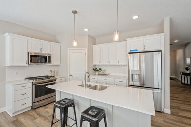 Kitchen -  photo is of a previous inventory home. Inquire for more details and options.